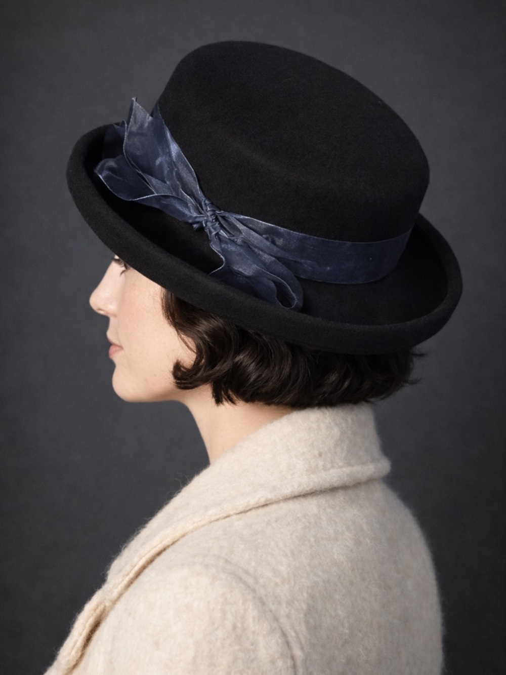 Vintage Laura Ashley wool flat top derby hat with blue translucent bow.